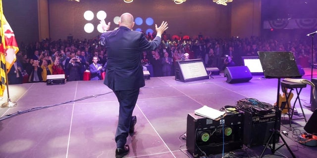 Term-limited Republican Gov. Larry Hogan takes to the stage at a celebration of his eight years steering the blue state of Maryland, at an event in Baltimore, Maryland on Nov. 30, 2022