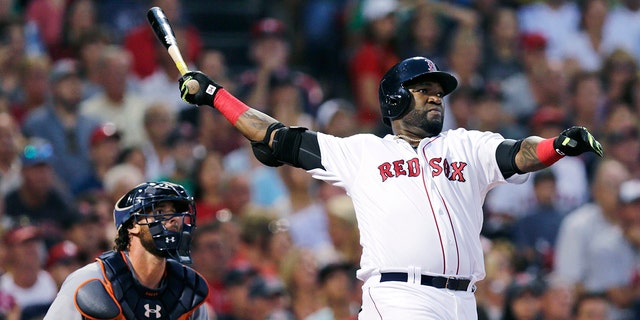 In this July 26, 2016, photo, Boston Red Sox designated hitter David Ortiz and Detroit Tigers catcher Jarrod Saltalamacchia watch the flight of Ortiz's three-run home run.