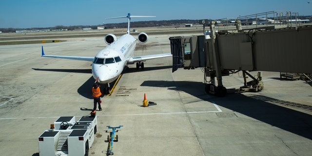 A plane arrives at a docking bay April 18, 2014, at the Madison, Wisconsin airport. 