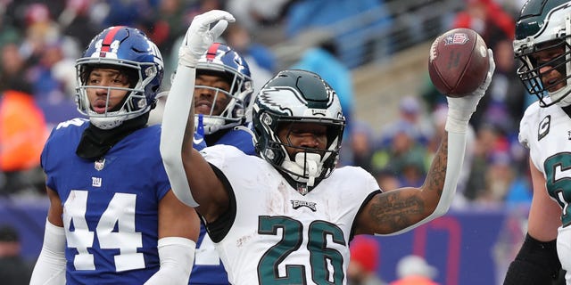 Miles Sanders #26 of the Philadelphia Eagles celebrates after a touchdown during the first quarter of the game against the New York Giants at MetLife Stadium on December 11, 2022 in East Rutherford, New Jersey.