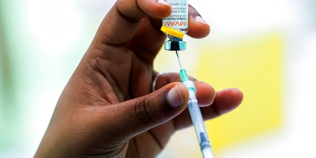 A health care worker prepares a monkeypox vaccine in Montreal, Saturday, July 23, 2022. On Thursday, San Francisco declared a state of emergency over the virus. 