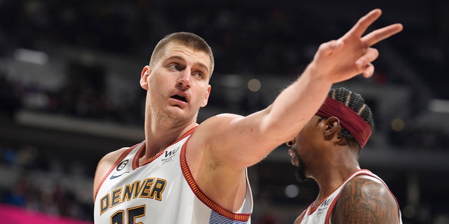 Denver Nuggets center Nikola Jokic gestures after being called for a foul in the second half of an NBA basketball game against the Charlotte Hornets, Sunday, Dec. 18, 2022, in Denver.