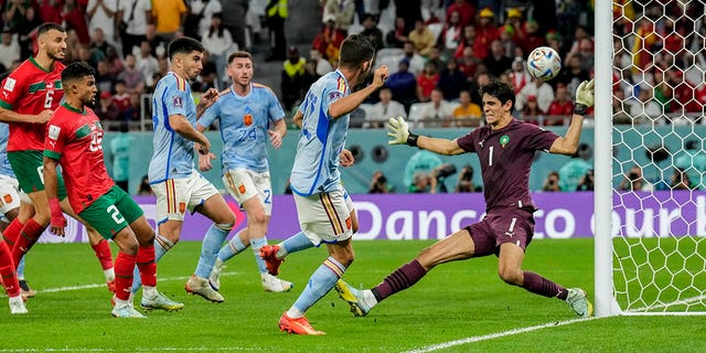 Spain's Pablo Sarabia tries a shot during the World Cup Round of 16 soccer match between Morocco and Spain, at the Education City Stadium in Al Rayyan, Qatar, Tuesday, Dec. 6, 2022. 