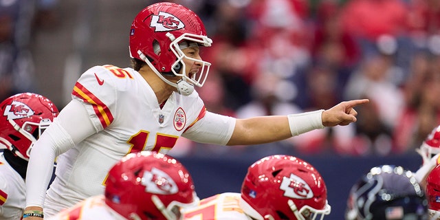 Patrick Mahomes #15 of the Kansas City Chiefs calls a play at the line of scrimmage against the Houston Texans during the first half at NRG Stadium on December 18, 2022 in Houston, Texas. 