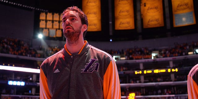 Pau Gasol, #16 of the Los Angeles Lakers, stands in observance of the national anthem before a game against the Oklahoma City Thunder at Staples Center on March 9, 2014, in Los Angeles, California.