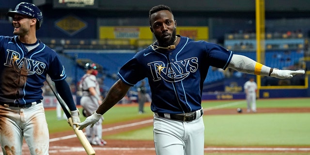 Tampa Bay Rays' Randy Arozarena celebrates after scoring on an RBI double by Yandy Diaz off Boston Red Sox pitcher Stephen Gonsalves during the third inning of a baseball game Tuesday, Aug. 31, 2021, in St. Petersburg, Florida.