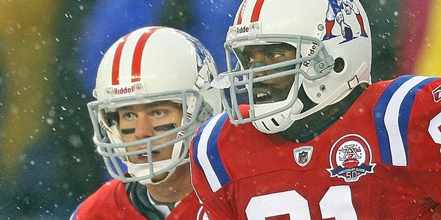 New England Patriots quarterback Tom Brady and wide receiver Randy Moss ran off the field after Moss' 1st TD catch on the play of the game in the 2nd quarter during the Pats 59-0 victory at Gillette Stadium on Sunday, Oct. 18, 2009.  