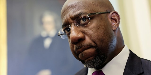 Sen. Raphael Warnock, D-Ga., arrives for the Senate Democrats weekly policy lunch at the U.S. Capitol in Washington, June 15, 2021.