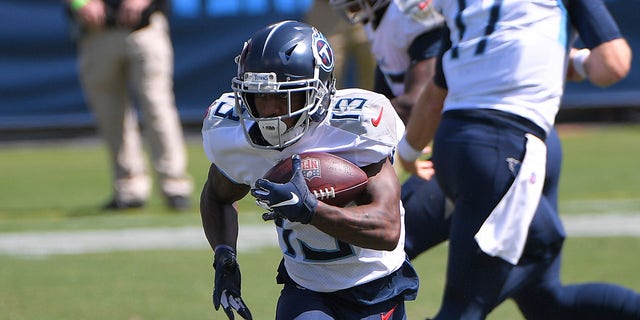 Sep 20, 2020; Nashville, Tennessee, USA;  Tennessee Titans wide receiver Cameron Batson (13) runs with the ball at Nissan Stadium.