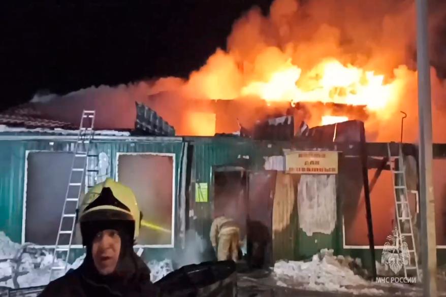 firefighters try to extinguish a fire at a nursing home in the Siberian city of Kemerovo, Russia.