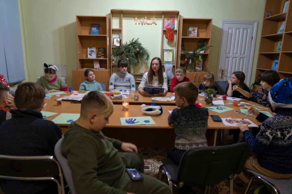 Children traumatized by the war are spotted drawing in the Center for Social and Psychological Rehabilitation in Boyarka, Ukraine, on Dec. 7, 2022.