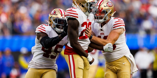 San Francisco 49ers linebacker Demetrius Flannigan-Fowles, #45,, San Francisco 49ers cornerback Samuel Womack III, #26, and San Francisco 49ers long snapper Taybor Pepper, #46, celebrate during an NFL football game between the San Francisco 49ers and the Los Angeles Rams on Oct. 30, 2022 at SoFi Stadium in Inglewood, California.