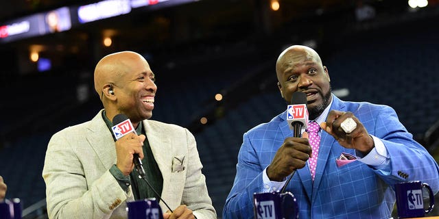 Kenny Smith and Shaquille O'Neal provide commentary before the game between the Toronto Raptors and Golden State Warriors in Game Three of the NBA Finals on June 5, 2019 at ORACLE Arena in Oakland, California.