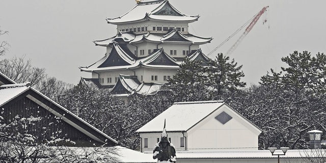 Nagoya castle is covered with snow on a winter day in Nagoya, Aichi prefecture, central Japan, on Dec. 24, 2022. (Kyodo News via AP)