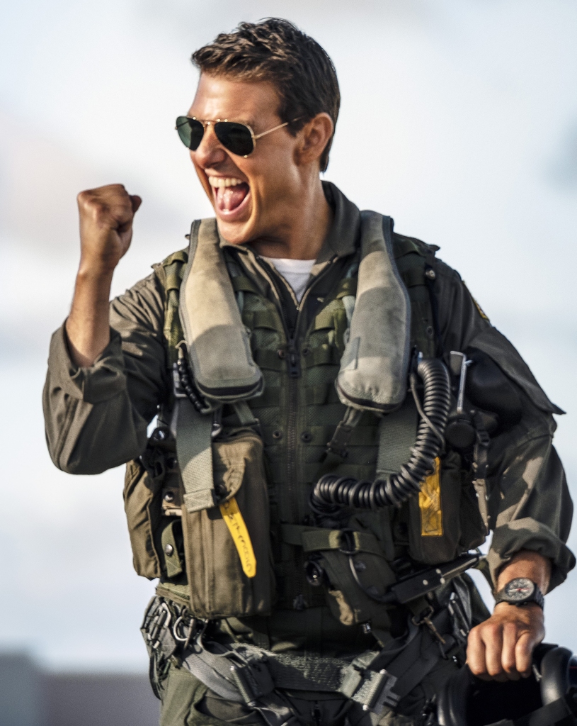 Tom Cruise in "Top Gun: Maverick" smirking in aviators. 
