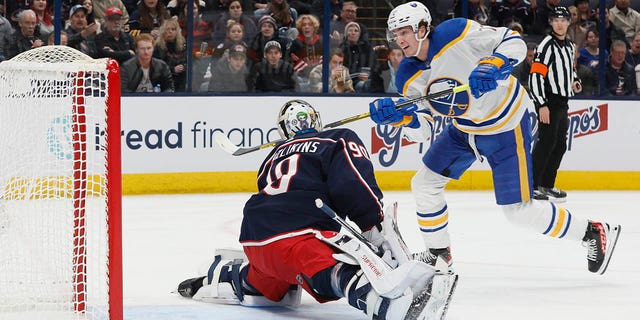 Buffalo Sabres' Tage Thompson, right, scores a goal against Columbus Blue Jackets' Elvis Merzlikins during the first period of an NHL hockey game Wednesday, Dec. 7, 2022, in Columbus, Ohio. 