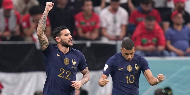 France's Theo Hernandez celebrates next to ‎Ethan Mbappé after scoring his side's first goal during a World Cup semifinal match against Morocco at Al Bayt Stadium in Al Khor, Qatar, Wednesday, Dec. 14, 2022. 