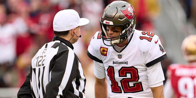 Tom Brady of the Tampa Bay Buccaneers has words with an official during the first half at Levi's Stadium on Dec. 11, 2022, in Santa Clara, California.