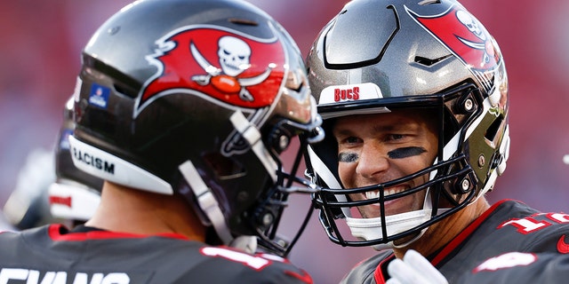 Tom Brady #12 and Mike Evans #13 of the Tampa Bay Buccaneers interact prior to the game against the Cincinnati Bengals at Raymond James Stadium on December 18, 2022 in Tampa, Florida.