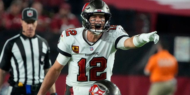 Tampa Bay Buccaneers quarterback Tom Brady (12) calls a play against the Arizona Cardinals during the second half of an NFL football game, Sunday, Dec. 25, 2022, in Glendale, Ariz. 