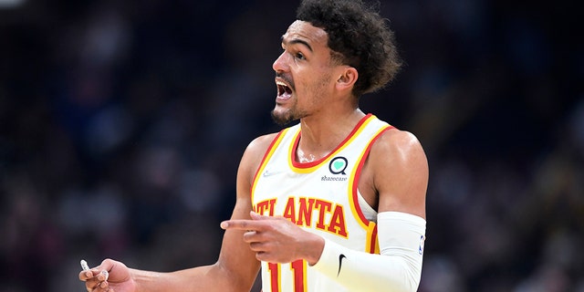 Atlanta Hawks guard Trae Young reacts to a foul call during the first half against the Cleveland Cavaliers, April 15, 2022, in Cleveland.