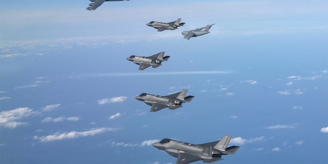 A U.S. B-52 bomber, C-17 and South Korean Air Force F-35 fighter jets fly over the Korean Peninsula during a joint air drill in South Korea, Tuesday, Dec. 20, 2022. 