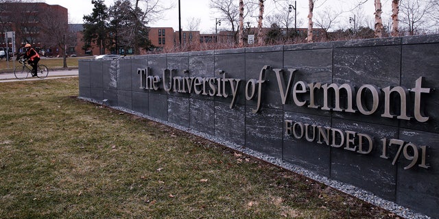 FILE - A bicyclist is seen on the campus of the University of Vermont in Burlington, Vt., Wednesday, March 11, 2020. The U.S. Department of Education is investigating allegations of antisemitism at the University of Vermont, including that some Jewish students were excluded from campus clubs and a teaching assistant threatened to reduce the grades of students who support the state of Israel. 