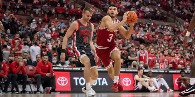 Indiana Hoosiers guard Anthony Leal #3 drives to the basket around Ohio State Buckeyes forward Justin Ahrens #10 during the game between the Ohio State Buckeyes and the Indiana Hoosiers at Value City Arena in Columbus, Ohio on February 21, 2022.