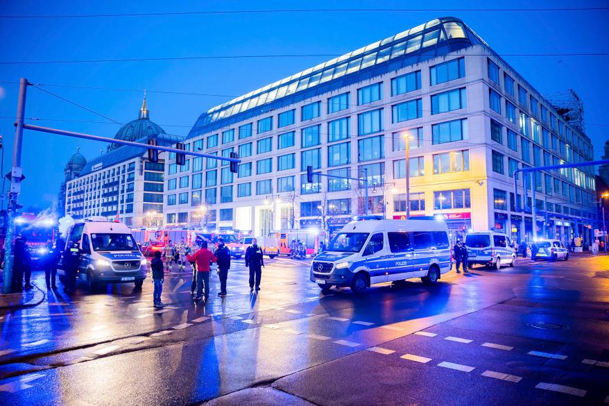 Police officers block a street after a huge aquarium burst at the Seal Life Aquarium in central Berlin, Germany, Friday, Dec. 16, 2022.