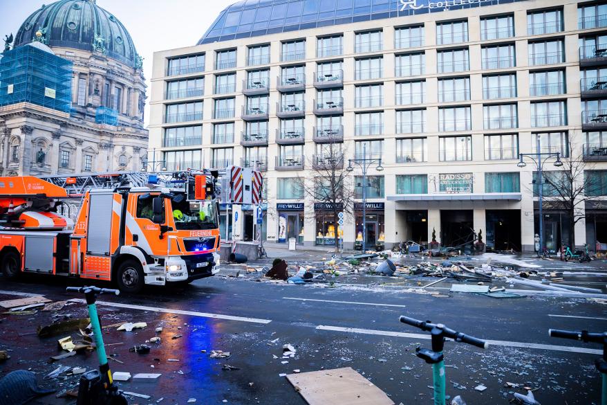 Debris lay on the street after a huge fish tank burst at the Seal Life Aquarium in central Berlin, Germany, Friday, Dec. 16, 2022.