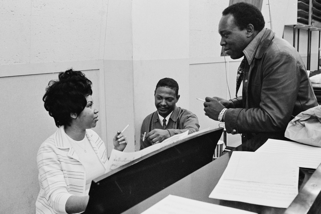 Aretha Franklin (with musical director and bandleader King Curtis, right) during a 1969 recording session of studio album “This Girl's in Love with You” in New York. 