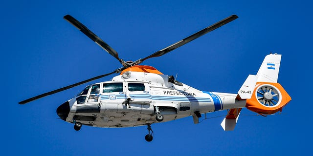 The World Cup champions fly in a helicopter over their fans during a victory parade on Dec. 20, 2022, in Buenos Aires, Argentina.