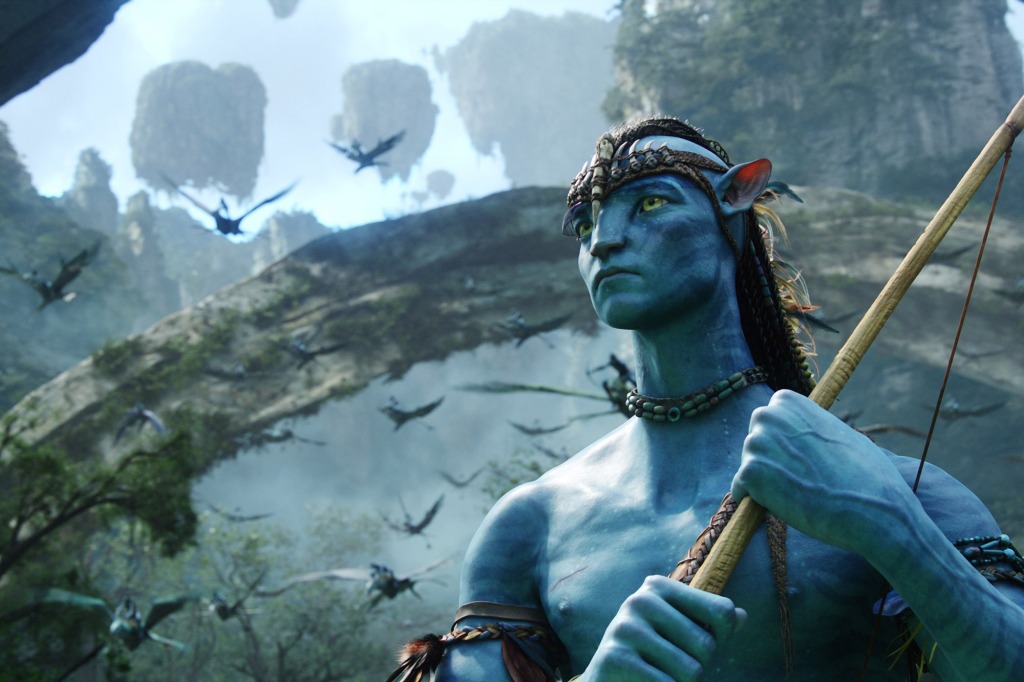 One of the Na'vi in "Avatar" holding a spear in the jungle. 
