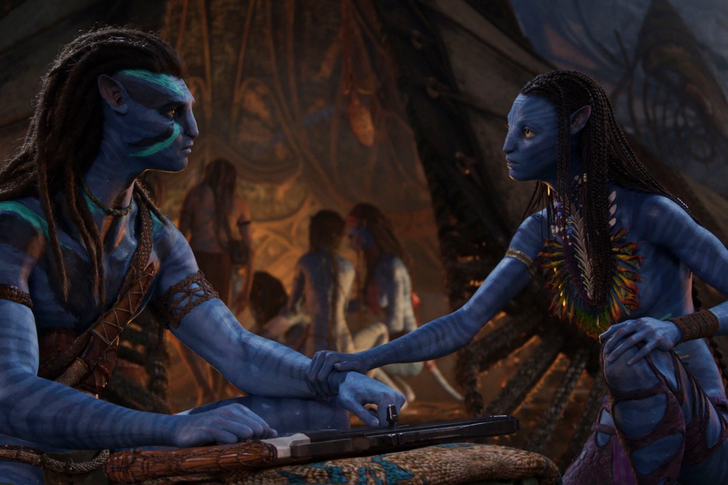 Jake Sully, voiced by Sam Worthington, left, and Neytiri, voiced by Zoe Saldana in a scene from "Avatar: The Way of Water."