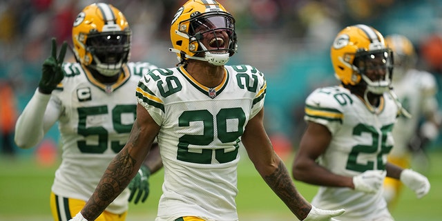 Green Bay Packers cornerback Rasul Douglas (29) celebrates making an interception, during the second half of an NFL football game against the Miami Dolphins, Sunday, Dec. 25, 2022, in Miami Gardens, Fla.