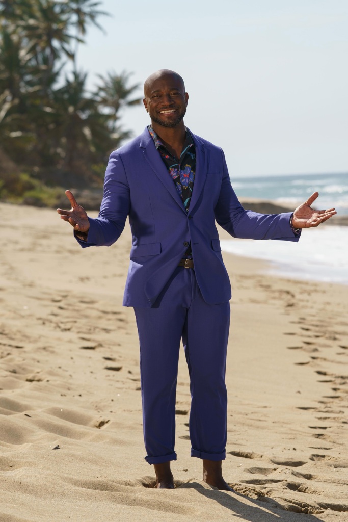 Taye Diggs standing on a beach. 