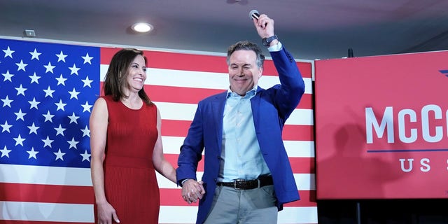 Dave McCormick and his wife Dinah Powell talk to supporters during his returns watch party in the Pennsylvania primary election, May 17, 2022, in Pittsburgh.