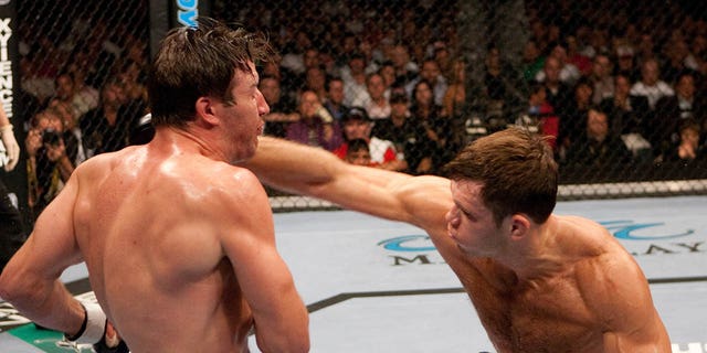 Forrest Griffin punches Stephan Bonnar at UFC 62 at the Mandalay Bay Events Center on Aug. 26, 2006, in Las Vegas. 