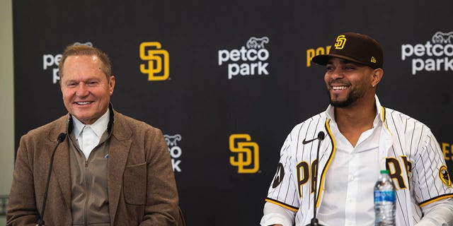 Xander Bogaerts, #2 of the San Diego Padres, and Agent Scott Boras address the media at an introductory press conference at PETCO Park on December 9, 2022, in San Diego, California.