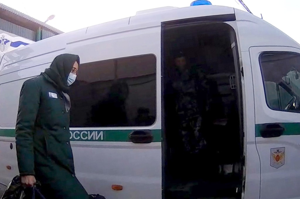 Griner boarding a bus after being released from the prison in Mordovia.