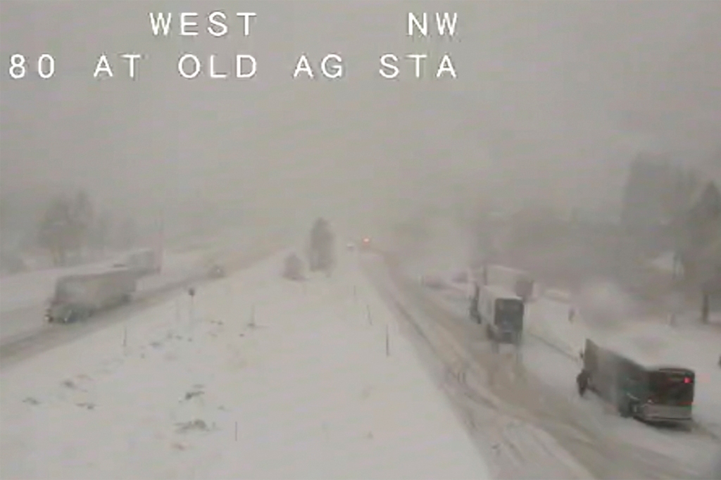 Traffic moves slowly through the snowy conditions along Interstate 80 near Truckee, California on Dec. 1, 2022.