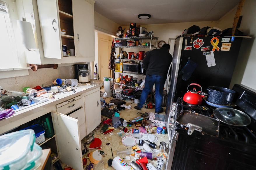 David Wrisley inspects the kitchen of his house after a strong 6.4-magnitude earthquake struck off the coast of northern California, in Rio Dell, California, U.S. December 20, 2022.