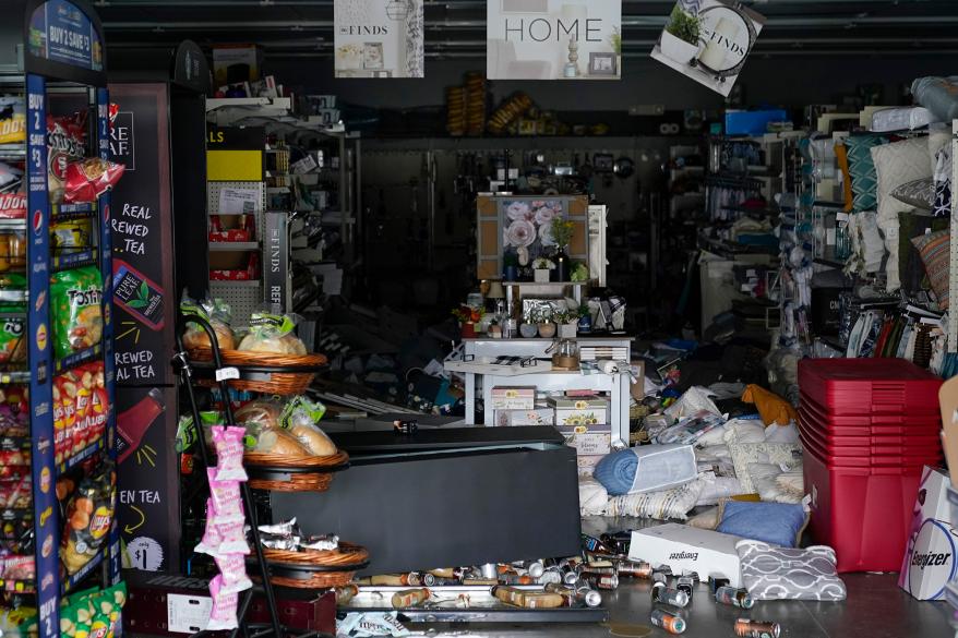 Merchandise can be seen knocked off the shelves inside a Dollar General store after an earthquake in Rio Dell, Calif., Tuesday, Dec. 20, 2022.