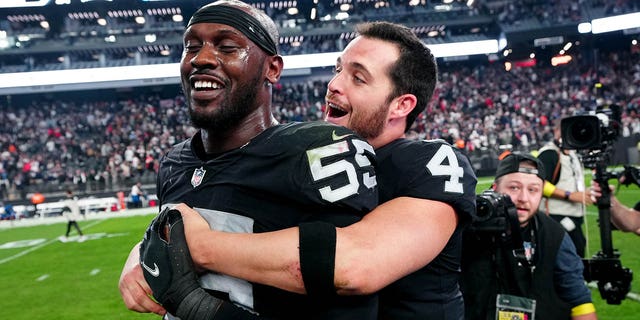 Chandler Jones #55 and Derek Carr #4 of the Las Vegas Raiders celebrate after defeating the New England Patriots at Allegiant Stadium on December 18, 2022 in Las Vegas, Nevada.