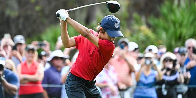 Charlie Woods swings over his ball on the first tee box during the final round of the PGA TOUR Champions PNC Championship at Ritz-Carlton Golf Club on December 19, 2021, in Orlando, Florida. 