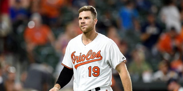 Chris Davis of the Baltimore Orioles walks to the dugout after striking out in the seventh inning against the Houston Astros at Oriole Park at Camden Yards on August 9, 2019, in Baltimore, Maryland.