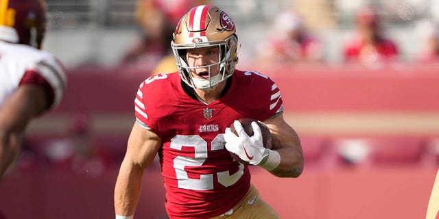 Christian McCaffrey #23 of the San Francisco 49ers carries the ball against the Washington Commanders during the first half of the game at Levi's Stadium on December 24, 2022 in Santa Clara, California. 