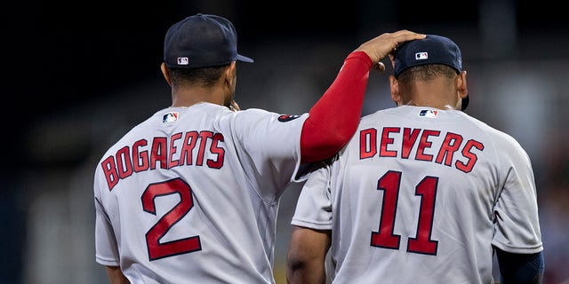 Xander Bogaerts and Rafael Devers of the Boston Red Sox during the third inning of the 2022 Little League Classic game against the Baltimore Orioles Aug. 21, 2022,  at Bowman Field in South Williamsport, Pa.