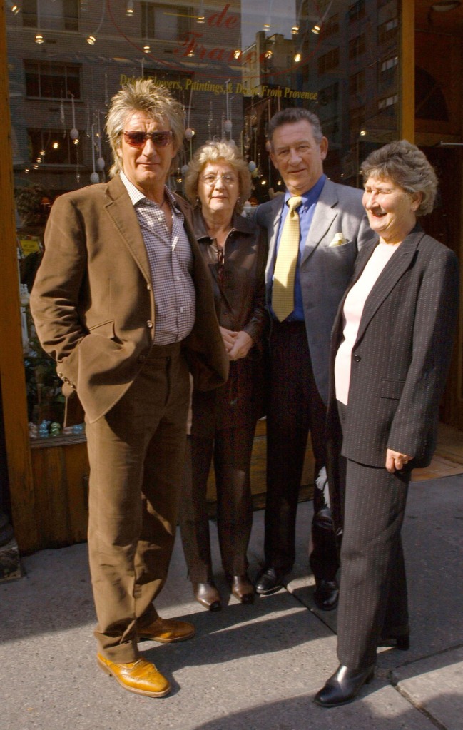 NEW YORK - MARCH 1:  *** EXCLUSIVE ***  (NY DAILY NEWS OUT, NEWSDAY OUT, ITALY OUT)   Rod Stewart stands in front of La Goulue Restaurant with his brother Don, Don's wife Pat (2nd L) and sister Mary (R) from Scotland March 1, 2004 in New York City.  (Photo by Arnaldo Magnani/Getty Images)