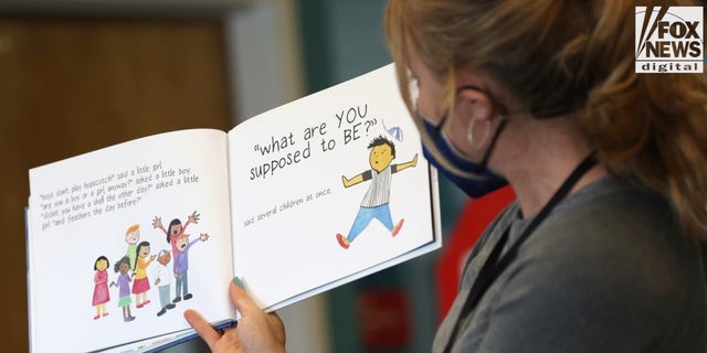 RICHMOND, CALIFORNIA - MAY 17: An elementary school teacher is seen reading a book about gender to students.